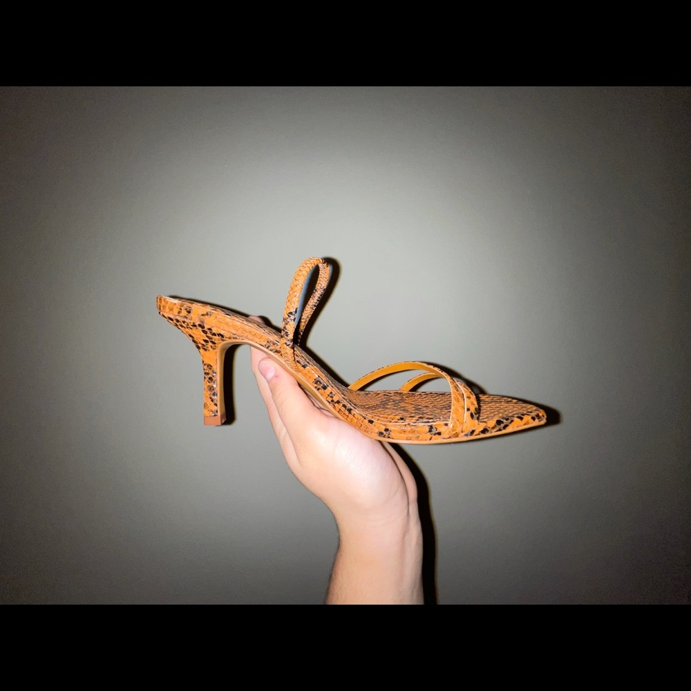 Snake skin, kitten heel sandal. Never worn! Has an elastic strap, versatile use